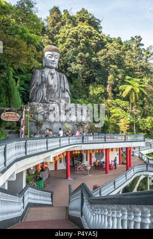 Pahang,Malaysia - Octpber 18,2017 : Stone buddha which is located at Chin Swee Caves Temple,Genting Highlands.People can seen exploring around it. Stock Photo