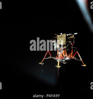 The Apollo 11 Lunar Module (LM), in a lunar landing configuration, is photographed in lunar orbit from the Command and Service Modules (CSM). Stock Photo