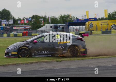 Dalton on Tees, England, 23 June 2018. Dan Lloyd driving a Honda Civic Type R for BTC Norlin Racing leaves the track and drives across the grass during qualification for the Dunlop MSA British Touring Car Championship at Croft Circuit. Credit: Colin Edwards/Alamy Live News. Stock Photo