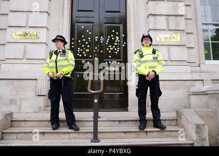 People's Vote, London, UK,  23rd June 2018. Police officers stand guard outside the governments Cabinet Office in Whitehall after the doors had been plastered with many Stop Brexit stickers by anti Brexit protesters - Photo Steven May /Alamy Live News Stock Photo