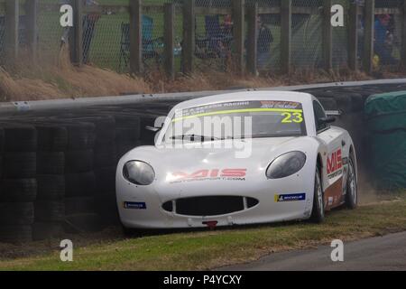Dalton on Tees, England, 23 June 2018. The Ginetta of Lorcan Hanafin facing the wrong way in the tyre barrier during qualification for the Ginetta Junior Championship at Croft Circuit. Credit: Colin Edwards/Alamy Live News. Stock Photo