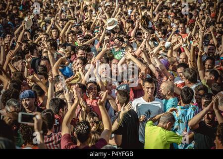 Ciutadella, Spain. 23 June, 2018:  The cheering crowd celebrates the traditional musicians at the end of the 'Caragol des Born' parade on the eve of the traditional 'Sant Joan' (Saint John) festival in Ciutadella de Menorca Stock Photo