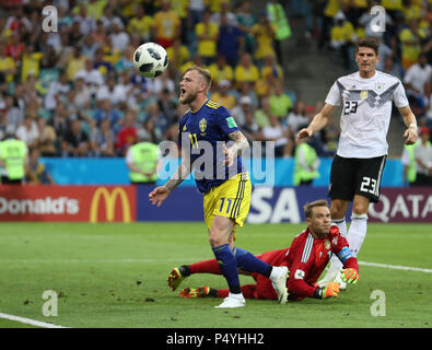Sochi, Russia. 23rd June, 2018. John Guidetti (L) of Sweden competes during the 2018 FIFA World Cup Group F match between Germany and Sweden in Sochi, Russia, June 23, 2018. Germany won 2-1. Credit: Lu Jinbo/Xinhua/Alamy Live News Stock Photo