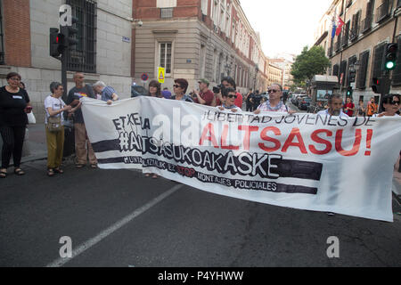 Madrid, Spain. 23rd June, 2018. Protester seen holding a banner during the demonstration. Thousands of demonstrators marched in support of young people from Altsasu (Navarra) in Madrid. They demand freedom for the eight young people sentenced to between 2 and 13 years in prison for assaulting two civil guards and their partners in Alsasua (Navarra) in 2016, to the cry of 'what a barbarity , Alsasua in jail and La Manada in freedom '. Credit: SOPA Images Limited/Alamy Live News Stock Photo