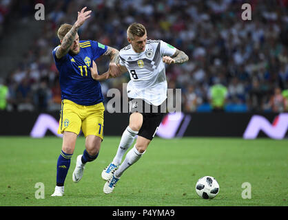 Sochi, Russland. 23rd June, 2018. duels, duel Toni Kroos (Germany) versus John Guidetti (Sweden). GES/Football/World Cup 2018 Russia: Germany - Sweden, 23.06.2018 GES/Soccer/Football/World Cup 2018 Russia: Germany vs Russia, Sochi, June 23, 2018 | usage worldwide Credit: dpa/Alamy Live News Stock Photo