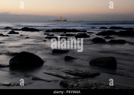 Durban, KwaZulu-Natal, South Africa, blur, breaking dawn, ships on horizon, Umhlanga Rocks beach, landscape, blurred, movement Stock Photo
