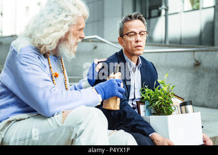 Two old friends drinking beer together Stock Photo