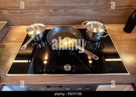 melting butter in a pan on a hot plate Stock Photo