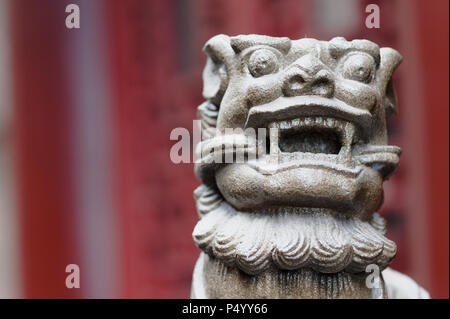 Lion stone statue in a buddhist temple, Chongqing, China Stock Photo