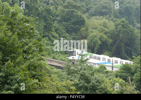 Chongqing, China - June 14, 2018 : Chongqing monorail in the mountain before entering Liziba station. Stock Photo