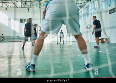 Men playing indoor soccer Stock Photo