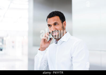 Businessman using smartphone Stock Photo