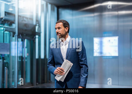 Businessman with newspaper Stock Photo