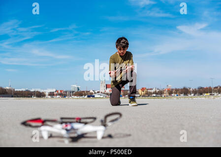 Boy flying drone Stock Photo