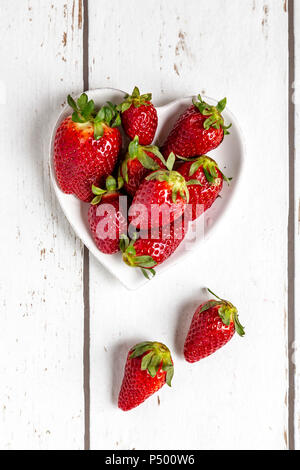 Strawberries in heart-shaped bowl Stock Photo