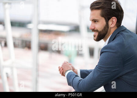 Portrait of smiling young businessman Stock Photo