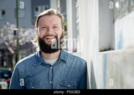 Portrait of bearded man laughing Stock Photo