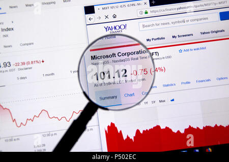 MONTREAL, CANADA - JUNE 22, 2018: Microsoft MSFT ticker with charts under magnifying glass on Yahoo Finance. Stock Photo