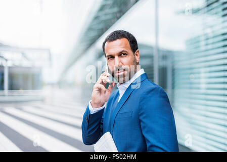 Businessman using smartphone Stock Photo