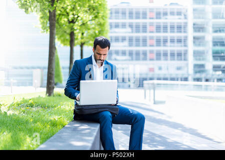 Businessman using laptop Stock Photo