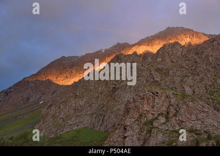 Beautiful alpenglow in the Tian Shan Mountains, Karakol, Kyrgyzstan Stock Photo