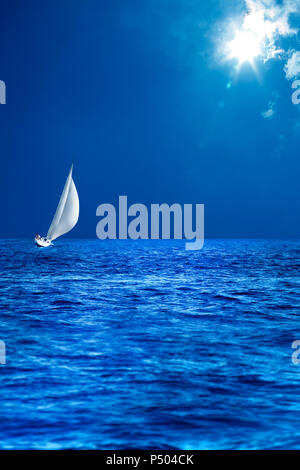 seascape image of sailing boat on sea over sunny sky. Stock Photo