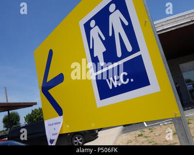 Motorway sevice area bathroom loo direction sign Stock Photo