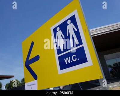 Motorway sevice area bathroom loo direction sign Stock Photo