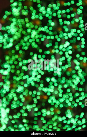 Green abstract bokeh background with new year tree lights Stock Photo