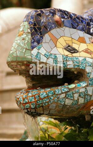 Spain. Catalonia. Barcelona. Park Guell. Built by Antoni Gaudi (1852-1926).  Dragon at the entrance. (1900-1914). Detail. Head. Stock Photo
