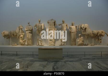 Decoration of the Temple of Zeus in the Sanctuary of Olympia. 5th century B.C. Parian marble sculptures that decorated the east pediment of the temple and represent the competition between Pelops and Oenomaus. Dated to the year 460 BCE. Olympia Archaeological Museum. Greece. Stock Photo