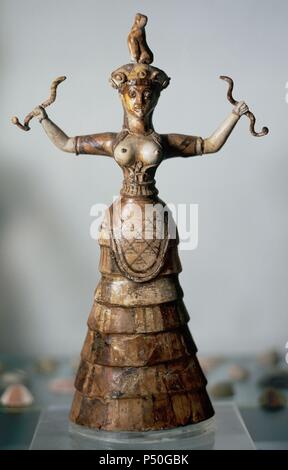 Minoan Art. Island of Crete. The younger snake goddess, from the palace of Knossos.  C. 1600 BC. Heraklion Archaeological Museum. Greece. Stock Photo