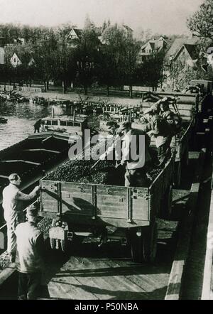 Post-war Germany. Berlin Blockade (24 June 1948-12 may 1949). The Western Allies organized the Berlin airlift. Ships carrying coal on Lake Havel. Photography. Stock Photo