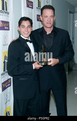 Tom Hanks and the kid from 'Road to Perdition' Taylor Hoechlin backstage at the Hollywood Movie Awards at the beverly Hilton in Los Angeles. October 7, 2002.           -            HanksTom HoechlinTaylor15.jpgHanksTom HoechlinTaylor15  Event in Hollywood Life - California, Red Carpet Event, USA, Film Industry, Celebrities, Photography, Bestof, Arts Culture and Entertainment, Topix Celebrities fashion, Best of, Hollywood Life, Event in Hollywood Life - California,  backstage trophy, Awards show, movie celebrities, TV celebrities, Music celebrities, Topix, Bestof, Arts Culture and Entertainment Stock Photo