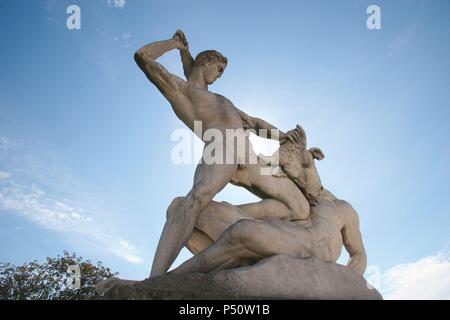 Classical Mythologi. Theseus slaying Minotaur. Statue 19th century AD. The Garden of the Tulleria (Tuileries). Paris. France. Europe. Stock Photo