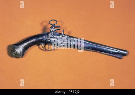 Pistol of flint stone. 18th century. Made in Ripoll (Girona province). Ethnographic Museum. Ripoll. Spain. Stock Photo