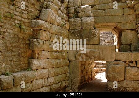 Cyclopean walls of the ancient city dating from IV century B.C. View of the gateway called Lion's Gate, one of the six entrances to the city. It shows a lion devouring a bull. Butrint. Republic of Albania. Stock Photo