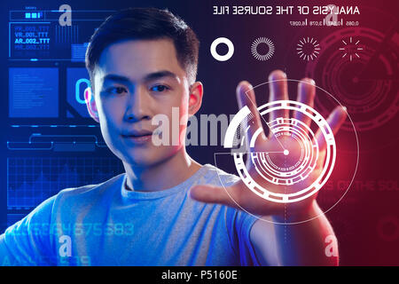 Qualified web developer looking at the image on the screen while working Stock Photo