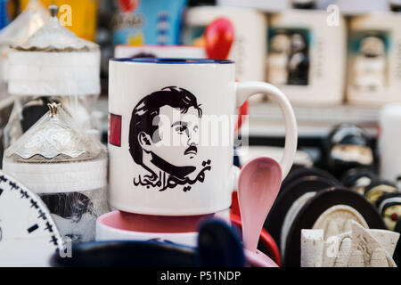 Doha, Qatar - Mart, 2018: Portrait of Qatari Emir - Tamim bin Hamad Al Thani on whirte souvenir cup.  Souq Waqif street. Stock Photo