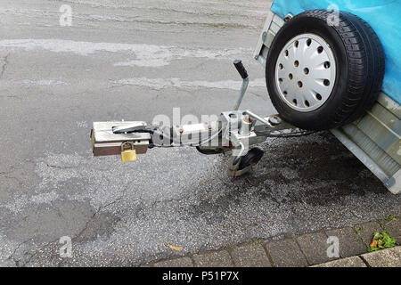 Towbar and jockey wheel with power connection and trailer lock in case of rain. Stock Photo