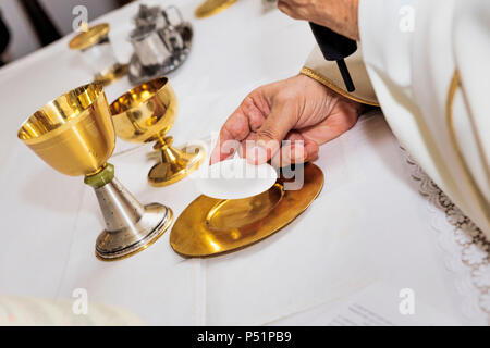 Catholic mass. Celebration of the Eucharist Stock Photo - Alamy