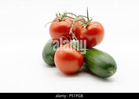 two cucumbers and five tomatoes Stock Photo