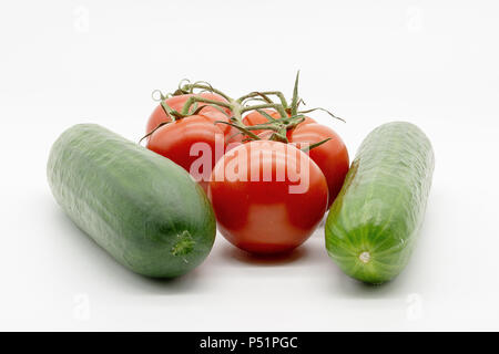 two cucumbers and five tomatoes Stock Photo