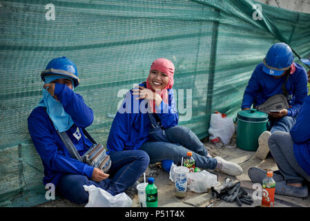 Woman builder. Thailand female construction worker. Thai builders, Asian building site Stock Photo