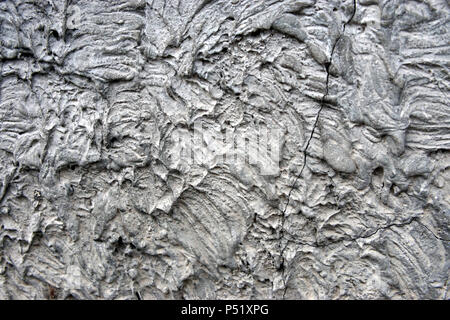 A stone wall covered in plaster macro Stock Photo