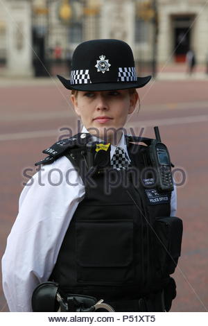 Police officers on duty in London with one female head turned amongst ...