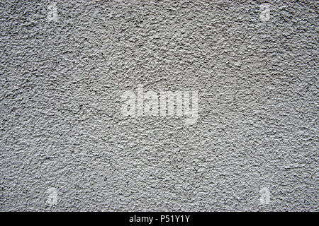 A stone wall covered in plaster macro Stock Photo