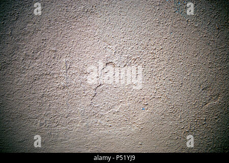 A stone wall covered in plaster macro Stock Photo