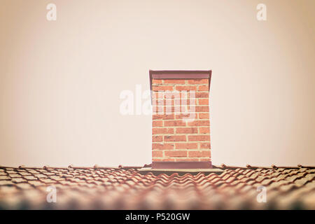 Chimney with roof on white. Sweden Stock Photo