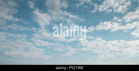 Blue sky with white fluffy clouds - midday cloudscape Stock Photo